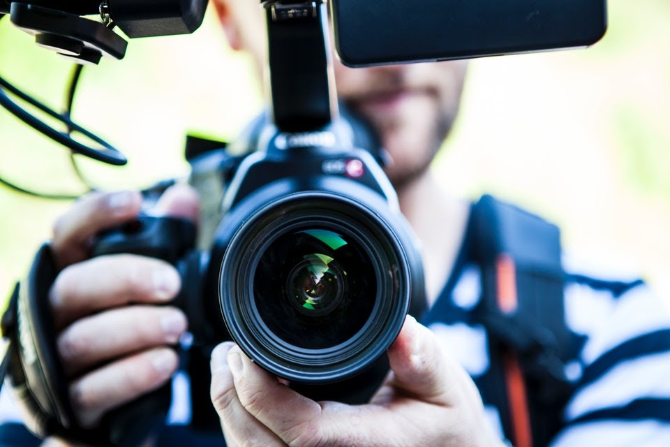 video marketing tips - holding video camera